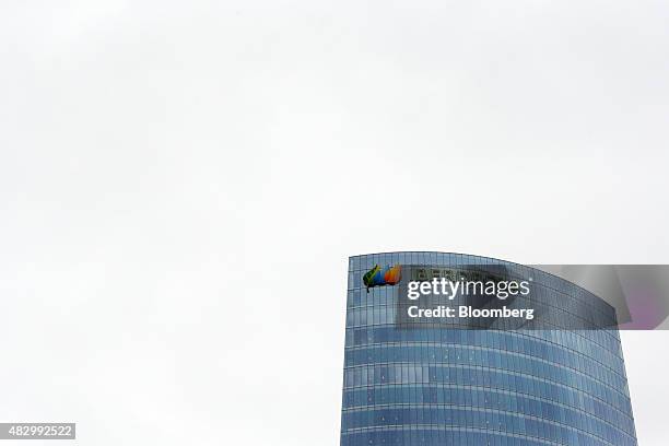 The logo of Iberdrola sits on display outside the headquarters of Iberdrola SA in Bilbao, Spain, on Tuesday, Aug. 4., 2015. Iberdrola SA, Spain's...