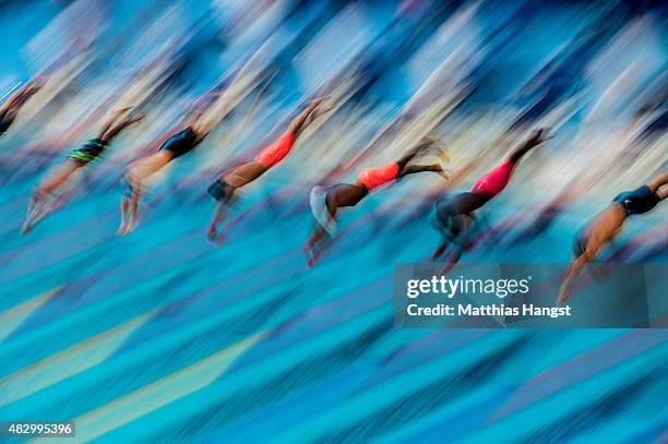 Swimmers dive in to start the Men's 100m Freestyle heat 5 on day twelve of the 16th FINA World Championships at the Kazan Arena on August 5, 2015 in...