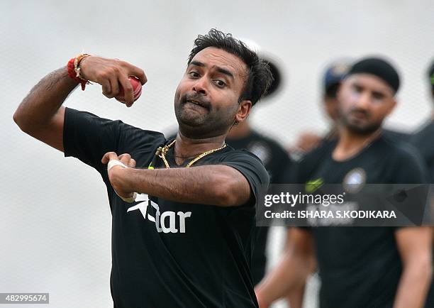 Indian cricketer Amit Mishra delivers a ball at a practice session at the R Premadasa International Cricket Stadium in Colombo on August 5, 2015. The...