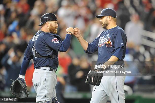 Ryan Doumit and Jordan Walden of the Atlanta Braves celebrate a win after a baseball against the Washington Nationals on April 5, 2014 at Nationals...