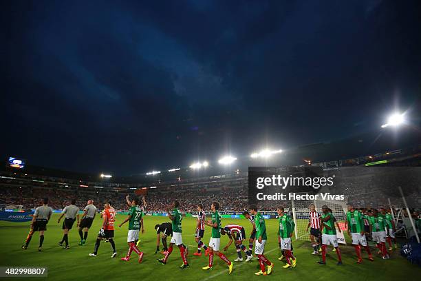 Players of Chivas and Pachuca enter to the field before a match between Pachuca and Chivas as part of the 14th round Clausura 2014 Liga MX at Hidalgo...