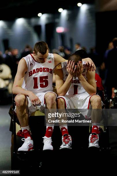 Sam Dekker and Ben Brust of the Wisconsin Badgers react after losing to the Kentucky Wildcats 74-73 in the NCAA Men's Final Four Semifinal at AT&T...