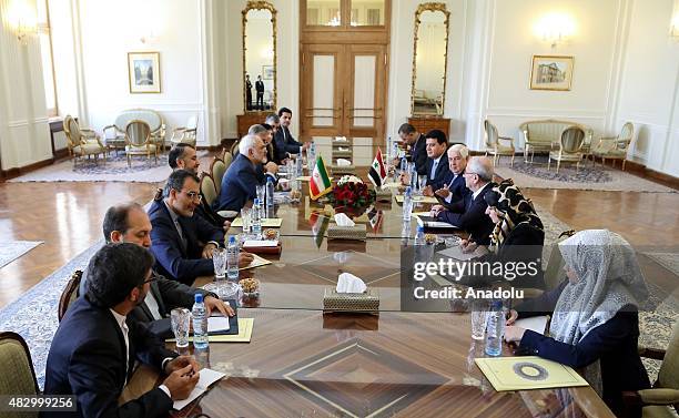 Iranian Foreign Minister Mohammad Javad Zarif and Syrian Foreign Minister Walid Muallem hold a meeting in the foreign ministry building in Tehran,...