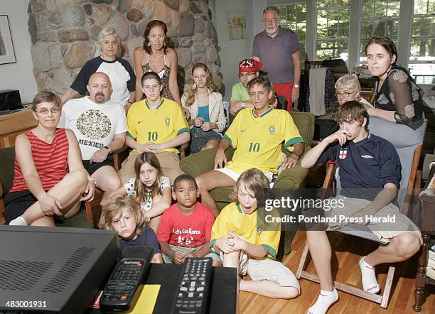 Staff photo by Gregory Rec -- Friday, June 30, 2006 -- Members of the Slavick family watch a World Cup soccer game between Germany and Argentina at...