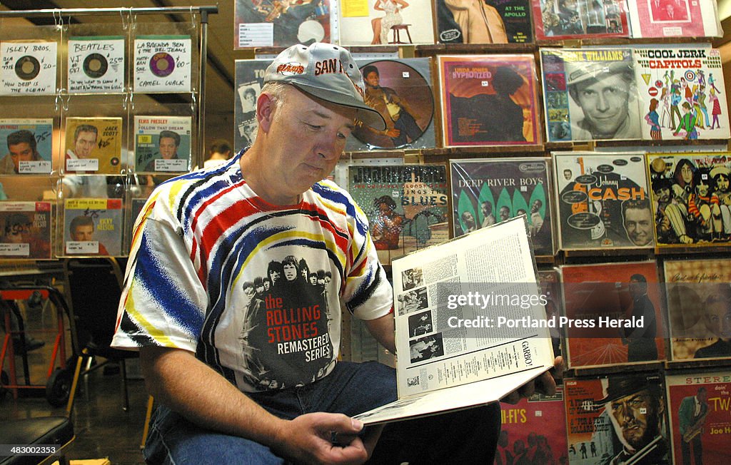Dave Pierce of Lynn, Massachusetts waits for customers at the Southern Maine Record Collector's club...