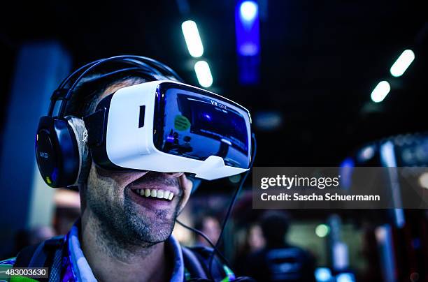 People play video games at the Gamescom 2015 gaming trade fair during the media day on August 5, 2015 in Cologne, Germany. Gamescom is the world's...