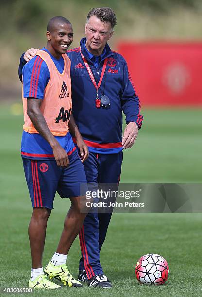 Manager Louis van Gaal and Ashley Young of Manchester United in action during a first team training session at Aon Training Complex on August 5, 2015...