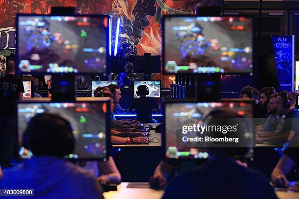 Gamers play computer games at the Gamescom video games trade fair in Cologne, Germany, on Wednesday, Aug. 5, 2015. The world's largest video-game...