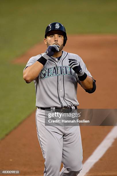 Jesus Montero of the Seattle Mariners celebrates hitting a home run against the Minnesota Twins during the game on July 31, 2015 at Target Field in...