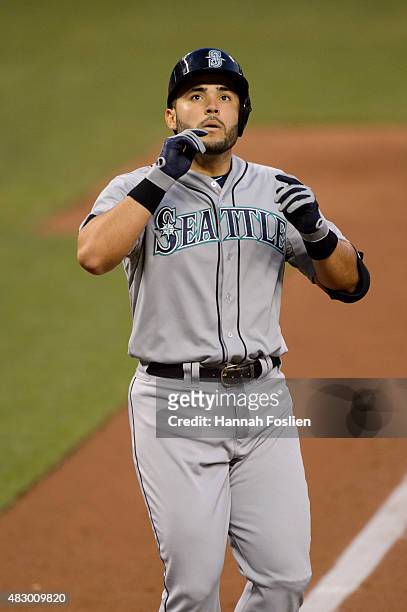 Jesus Montero of the Seattle Mariners celebrates hitting a home run against the Minnesota Twins during the game on July 31, 2015 at Target Field in...