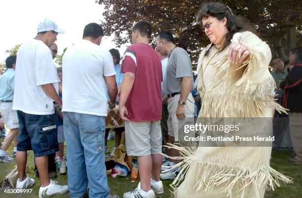 Staff Photo by John Ewing, Thursday, June 9, 2005: Marie Tomah, from the Indian Township in Princeton, dances around a group of native american...