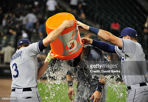 Evan Longoria of the Tampa Bay Rays Curt Casali give Richie Shaffer a gatorade bath after he had his first MLB hit against the Chicago White Sox on...