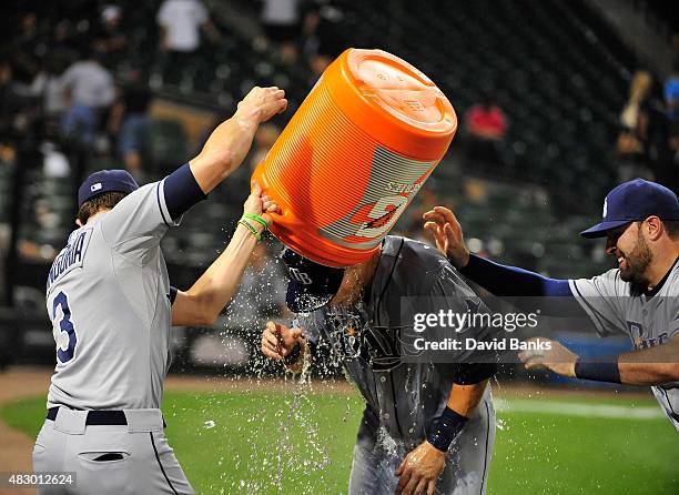 Evan Longoria of the Tampa Bay Rays Curt Casali give Richie Shaffer a gatorade bath after he had his first MLB hit against the Chicago White Sox on...