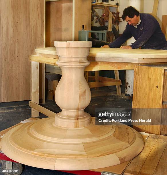 Staff Photo by Gordon Chibroski, Friday, March 5, 2004: A beautiful lathed rock maple table base was made by Steve Hanson of Hanson Wood Turning and...