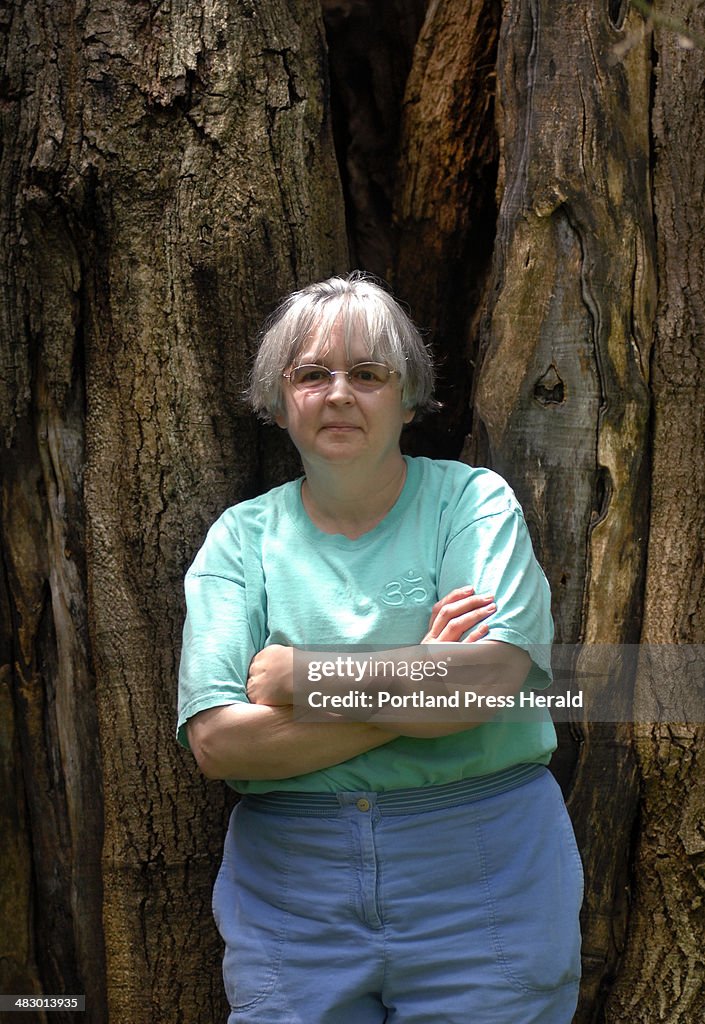 Author Tabitha King in front of an old Walnut tree at her home in Bangor.
