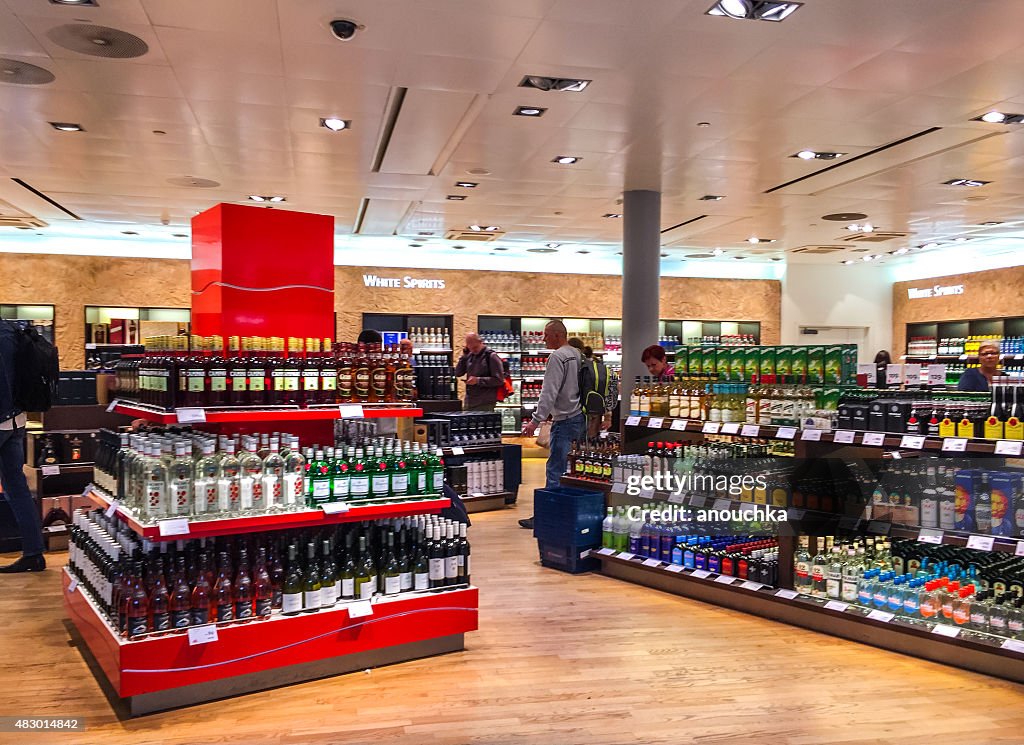 People shopping in Duty Free shops at Oslo Airport, Norway
