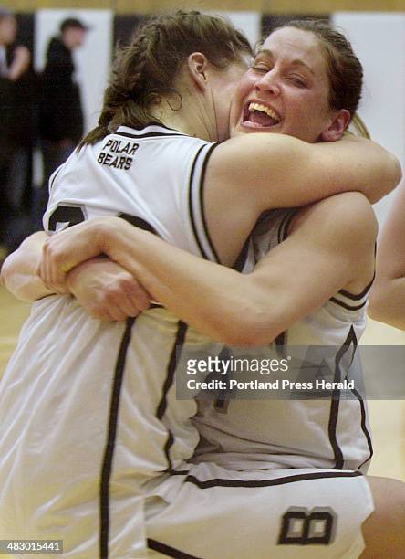 Staff Photo by Derek Davis, Sunday, February 27, 2005: Katie Cummings, left, jumps into the arms of teammate Alison Smith after Bowdoin defeated...