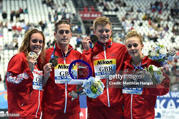 Gold medallists Fran Halsall, Chris Walker-Hebborn, Adam Peaty and Siobhan-Marie O'Connor of Great Britain pose during the medal ceremony for the...