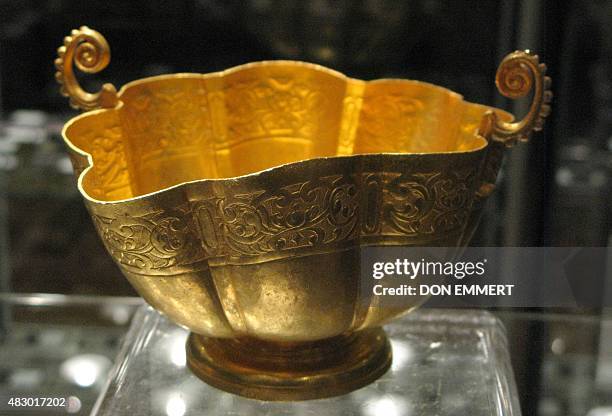 An gold chalice from a Spanish treasure from the 17th century is on display at Guernsey's August 5, 2015 in New York. On July 20 American treasure...