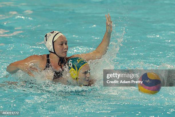 Courtney Mathewson of the United States and Bronwen Knox of Australia compete for the ball in the Women's Semi Final between the United States and...