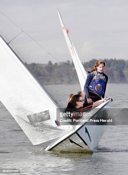 Staff photo by Gregory Rec -- Thursday, May 4, 2006 -- Emily Lambert, standing, and Ian Conners tack during sailing practice on Casco Bay last week....