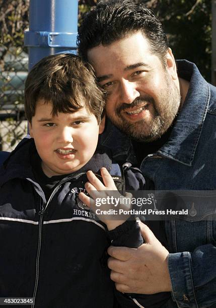 Staff Photo by Jill Brady, Friday, April 28, 2006: Timothy Emery and his son, Michael sit on the playground at Presumpscot School. *with Kelley B....