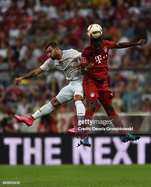 Jese of Real Madrid and David Alaba of FC Bayern Muenchen go up for a header during the Audi Cup 2015 Final between FC Bayern Muenchen and Real...