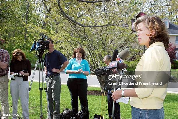 Staff Photo by Herb Swanson, Monday, May 17, 2004: Virginia Hanson, a spokesperson for the Cooley family, gives a statement in Cape Elizabeth to the...