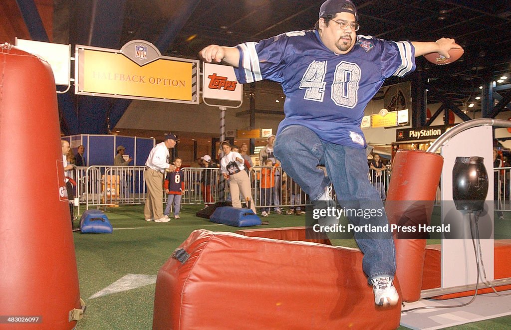 Miguel Carranza of San Antonio Texas leaps over a blocking dummy while competing in the Halfback Opt...