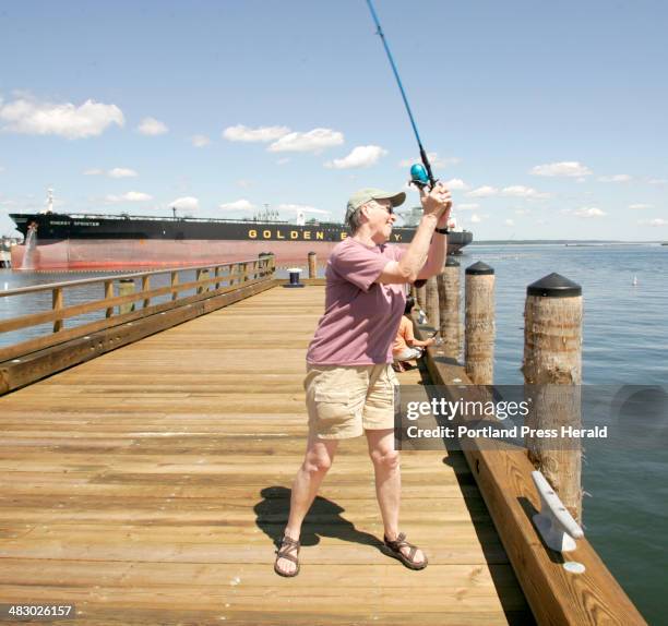 Staff Photo by Herb Swanson, Wednesday, July 19, 2006: Rachel Burger and Molly Gallagher fish from the newly renovated Southern Maine Community...