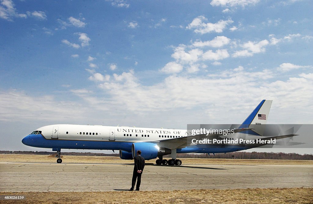 A U.S. Secret Service officer stands on the runway as Air Force One departs from Sanford airport fol...
