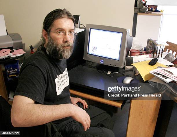 Staff Photo by Jill Brady, Thursday, April 20, 2006: Edward Page spends a lot of time at his computer in his apartment at Logan Place in Portland....