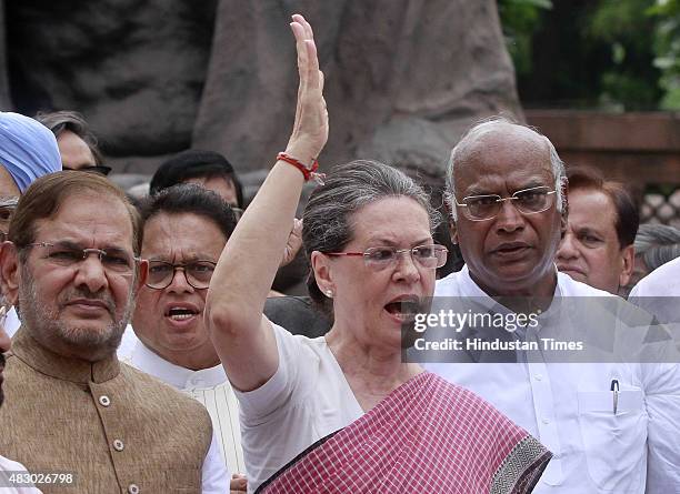Congress President Sonia Gandhi with JD leader Sharad Yadav and other leaders during a protest against the suspension of 25 party members, at...
