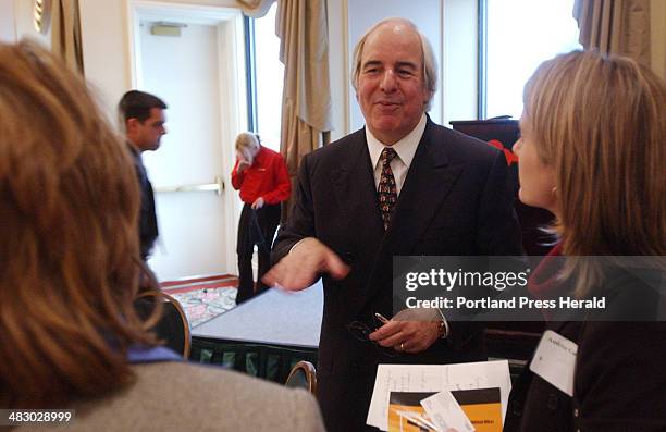 Staff Photo by Shawn Patrick Ouellette, Tuesday, April 13, 2004: Corporate fraud guru Frank Abagnale talks with people following his seminar at the...