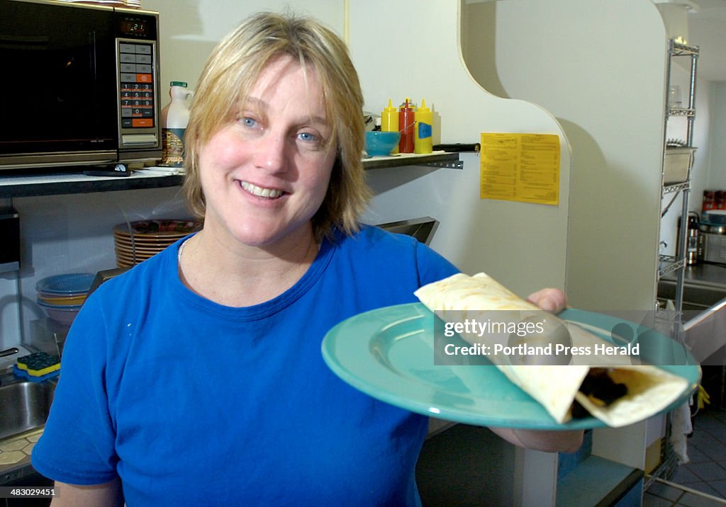 Lynne Perry shown with a breakfast burrito at her 'Go Go' restaurant in South Portland for eat n run
