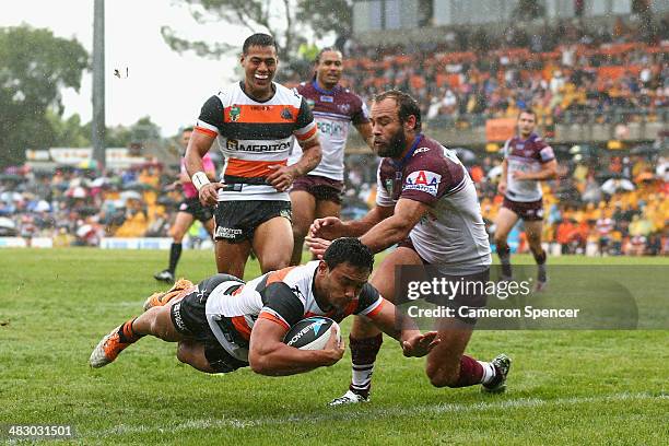 David Nofoaluma of the Tigers scores a try during the round five NRL match between the Wests Tigers and the Manly-Warringah Sea Eagles at Leichhardt...