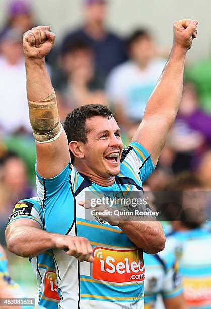 Greg Bird of the Titans celebrates kicking a goal from a penalty to win the match the round five NRL match between the Melbourne Storm and the Gold...