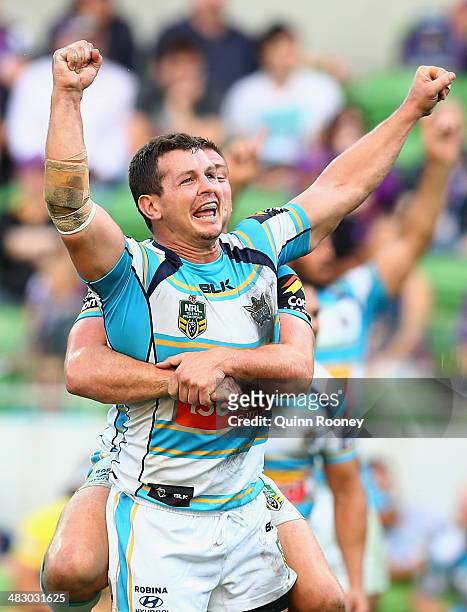 Greg Bird of the Titans celebrates kicking a goal from a penalty to win the match the round five NRL match between the Melbourne Storm and the Gold...