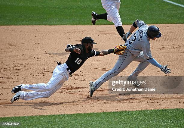 Alexei Ramirez of the Chicago White Sox lunges to tag out Asdrubal Cabrera of the Tampa Bay Rays on a run-down in the 7th inning at U.S. Cellular...