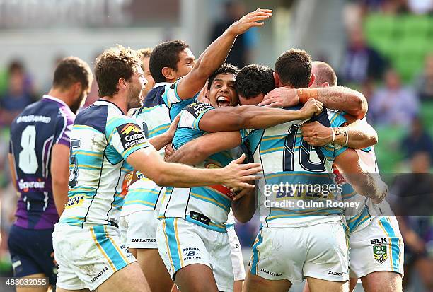 Titans players celebrate a try by Mark Minichiello during the round five NRL match between the Melbourne Storm and the Gold Coast Titans at AAMI Park...