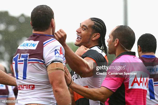 Martin Taupau of the Tigers has a scufffle with Jason King of the Sea Eagles during the round five NRL match between the Wests Tigers and the...