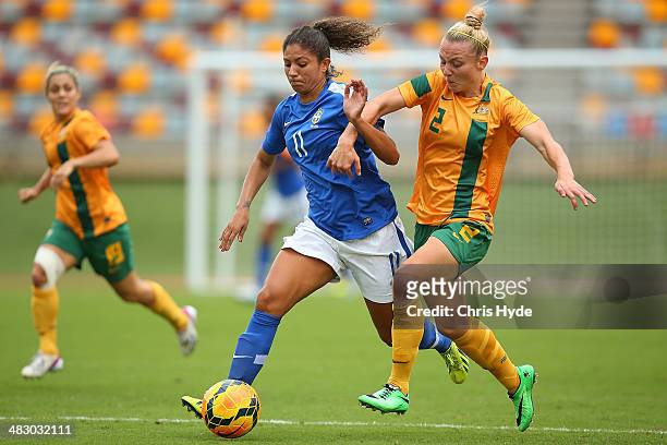 Cristiane Rozeira of Brazil and Teigan Allen of Australia compete for the ball during the Women's International Friendly match between the Australian...