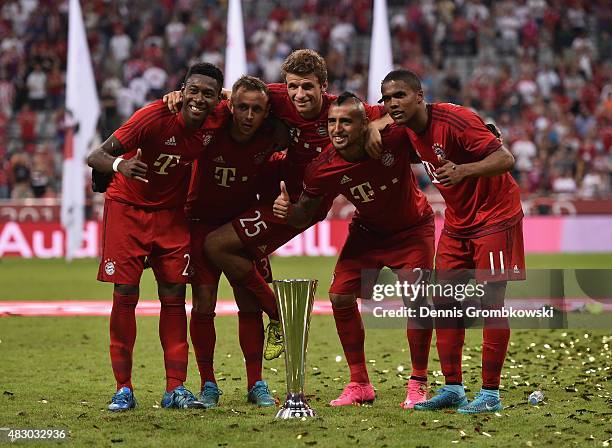 Bayern Muenchen players David Alaba, Rafinha, Thomas Mueller, Arturo Vidal and Douglas Costa celebrate after the Audi Cup 2015 Final between FC...