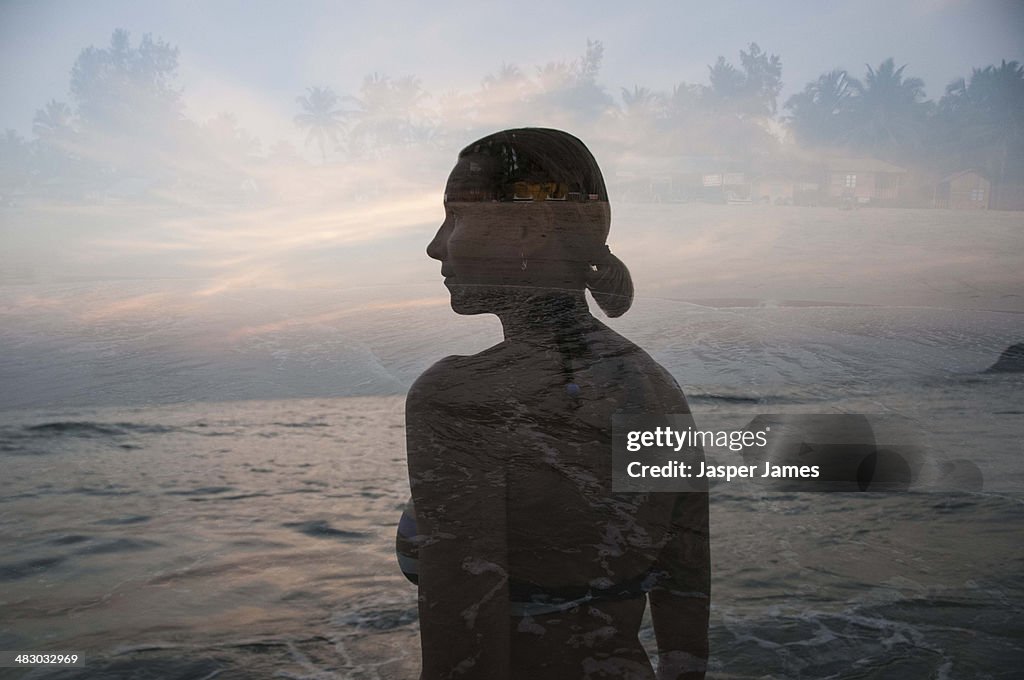 Woman in goa on the beach at sunset