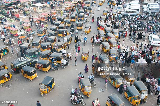 busy crowded street in hyderabad,india - tuk tuk stock pictures, royalty-free photos & images