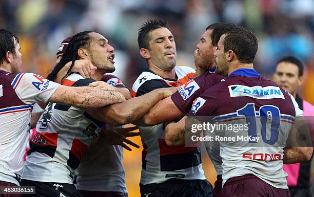 Martin Taupauof the Tigers and Josh Starling of Manly get into a fight during the round five NRL match between the Wests Tigers and the...