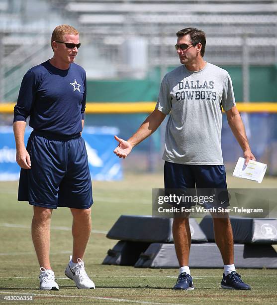 Dallas Cowboys head coach Jason Garrett, left, and wide receiver coach Derek Dooley during the team's morning session at training camp in Oxnard,...