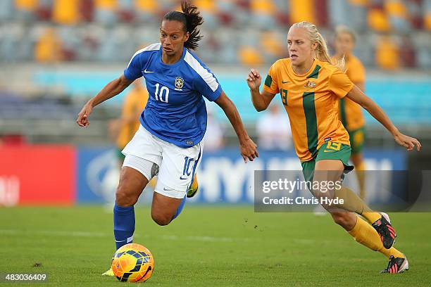 Rosana Augusto of Brazil and Tameka Butt of Australia compete for the ball during the Women's International Friendly match between the Australian...