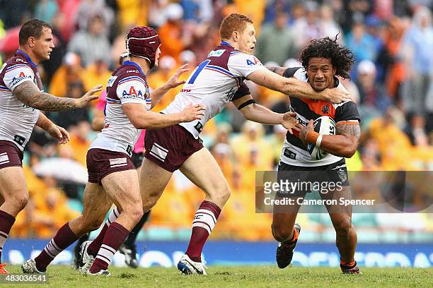 James Gavet of the Tigers is tackled during the round five NRL match between the Wests Tigers and the Manly-Warringah Sea Eagles at Leichhardt Oval...
