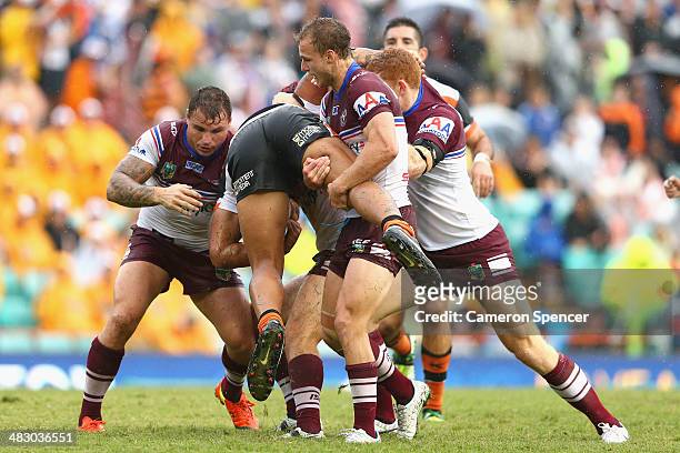 James Gavet of the Tigers is tackled during the round five NRL match between the Wests Tigers and the Manly-Warringah Sea Eagles at Leichhardt Oval...